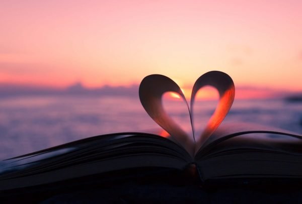 Heart from book against a beautiful sunset. | GracePoint Publishing