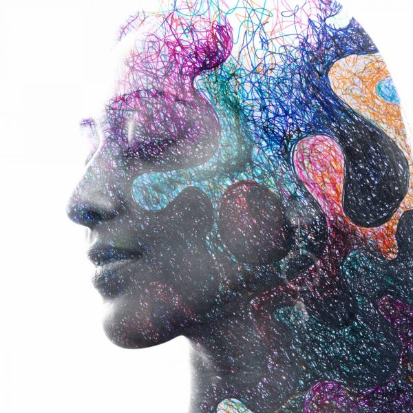 Paintography. Double exposure portrait of a young, beautiful, ethnic girl combined with hand drawn painting of intense color contrasting with black areas | GracePoint Publishing